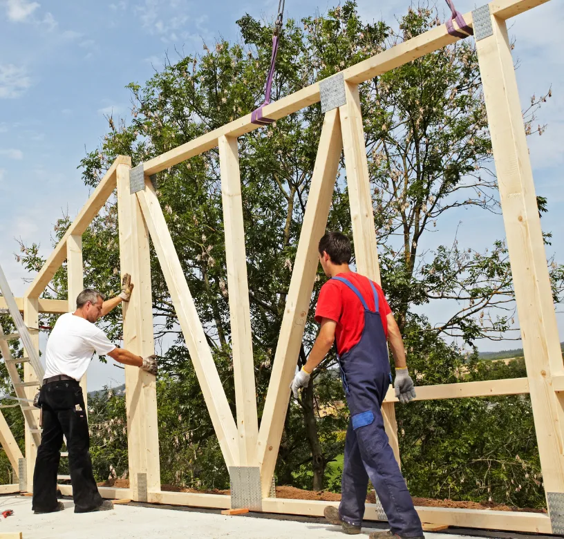 ADU construction team installing wooden structural framing for a residential accessory dwelling unit project in Dallas, Texas